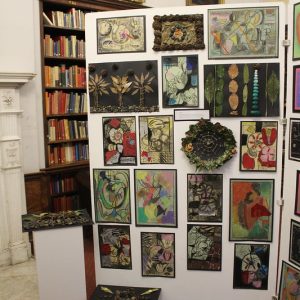 paintings on display in a library