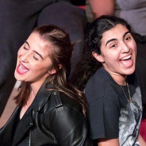 two girls laughing