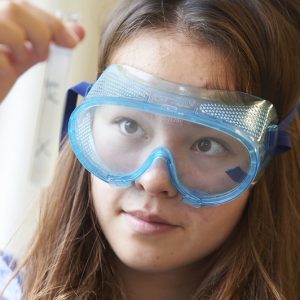 student wearing science goggles