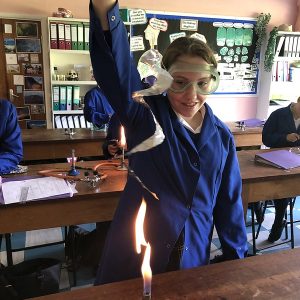 student using a bunsen burner